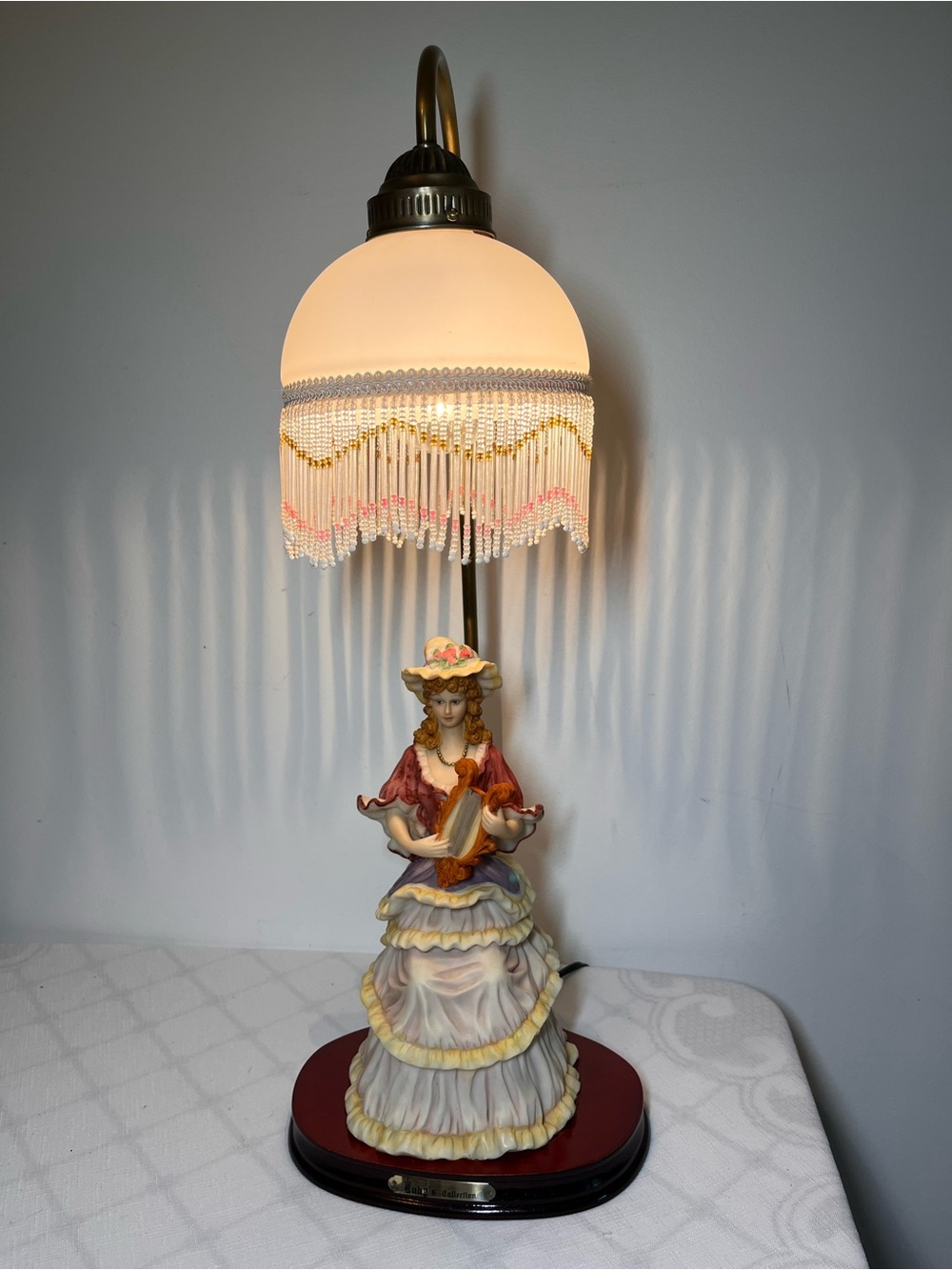 Vintage Victorian figural table lamp from Ruby's Collection
Glass shade w fringe